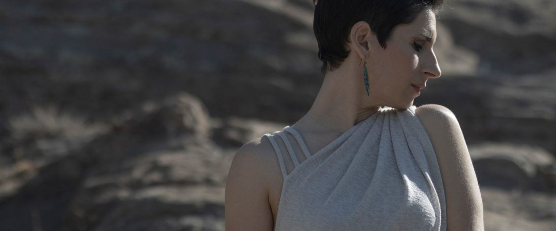 Woman modeling LYC Moab Dress in Sandstone/Closeup view